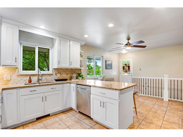 Property Photo 23 A kitchen thoughtfully reimagined for the modern cook - where the home's signature character meets serious culinary function.