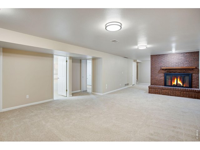 Property Photo 37 1,511 SQFT basement, loaded with storage, cozy wood burning floor to ceiling brick fireplace! 