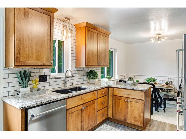 Property Photo 19 Updated with Granite and Beautiful Tile Backsplash
