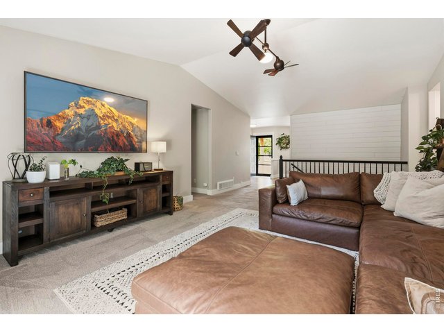 Property Photo 11 Living room with Vaulted Ceilings