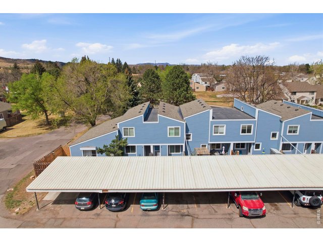Property Photo 3 2 reserved spots under an extended carport help to protect your cars from the Colorado elements.