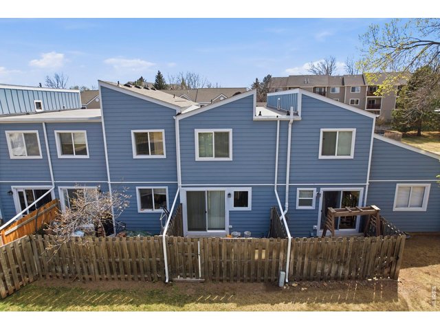 Property Photo 5 Enclosed back patio opens up to the greenbelt for easy playtime with your kids or pets.