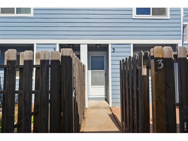 Property Photo 7 Enclosed front porch helps to add that sense of privacy and outdoor entertaining.