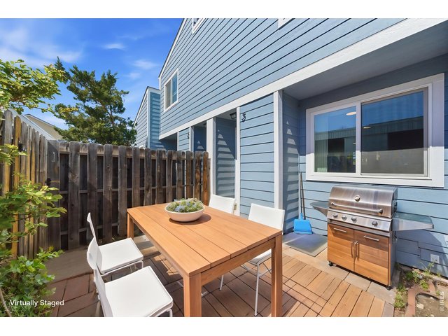 Property Photo 8 Enclosed front porch helps to add that sense of privacy and outdoor entertaining. ***Virtually staged with AI***