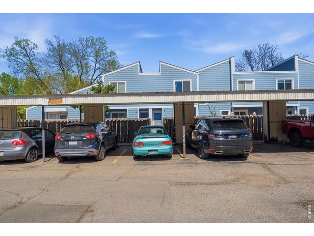 Property Photo 4 2 reserved spots under an extended carport help to protect your cars from the Colorado elements.