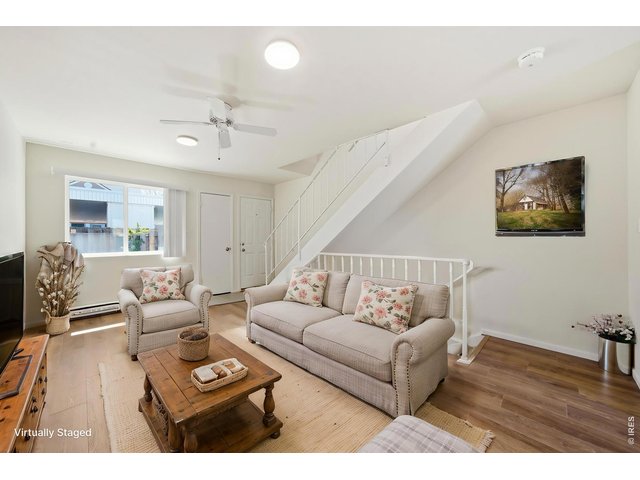 Property Photo 11 Bright and spacious living room with all with new LVP and paint. ***Virtually staged with AI***