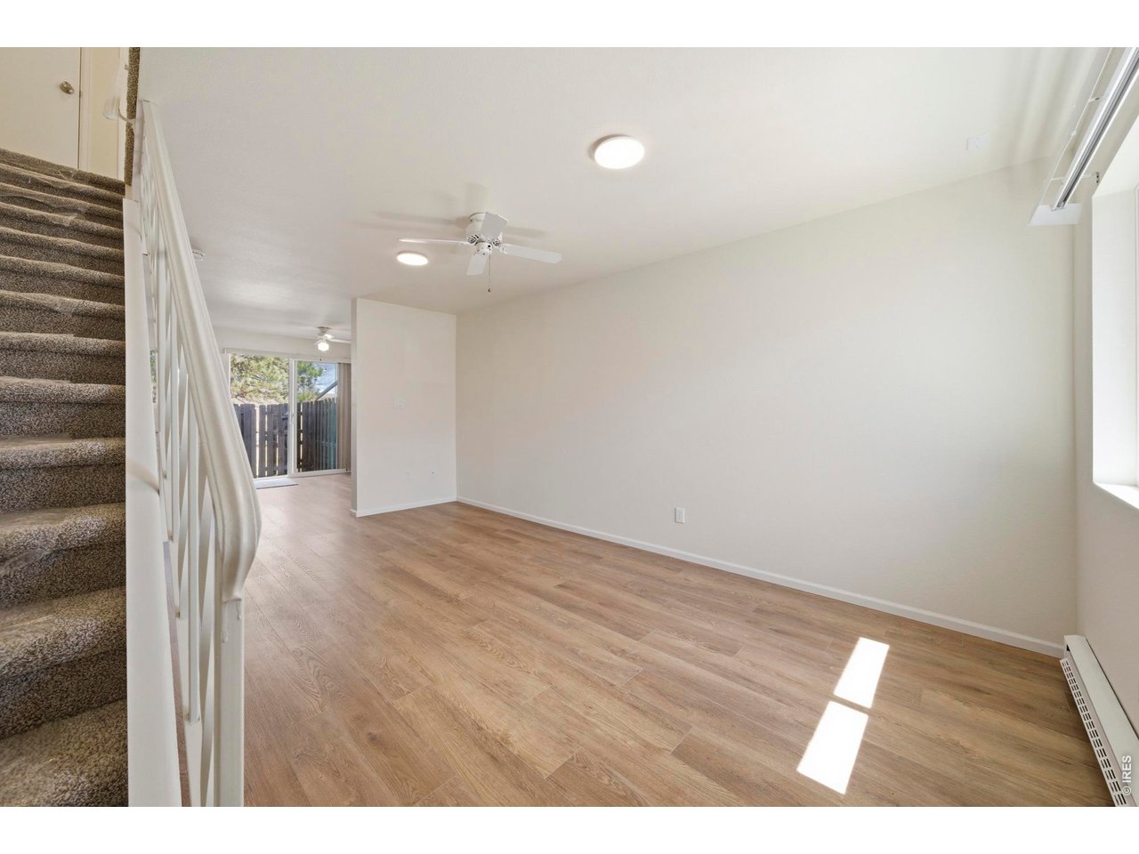 Open and bright entryway leads you to the living room and kitchen, all with new LVP and paint.