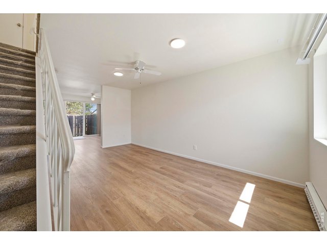 Property Photo 10 Open and bright entryway leads you to the living room and kitchen, all with new LVP and paint.