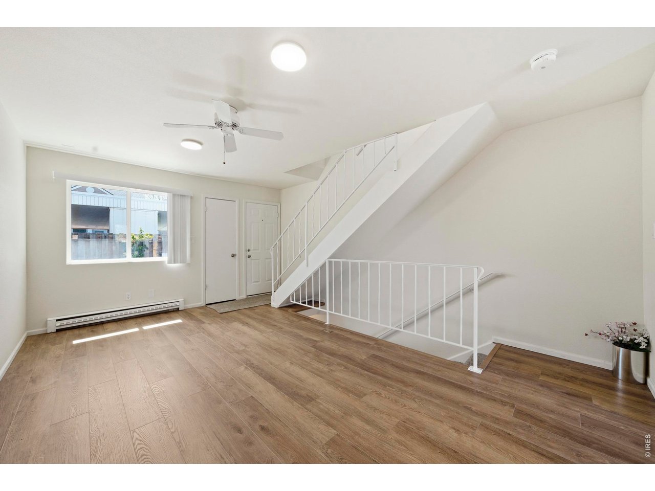 Bright and spacious living room with all with new LVP and paint.