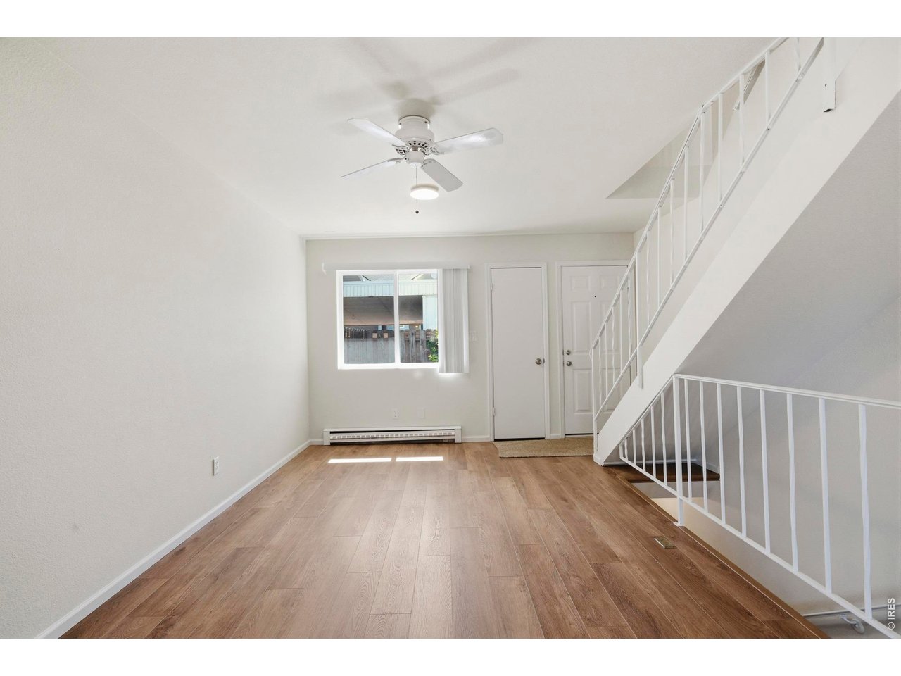 Bright and spacious living room with all with new LVP and paint.
