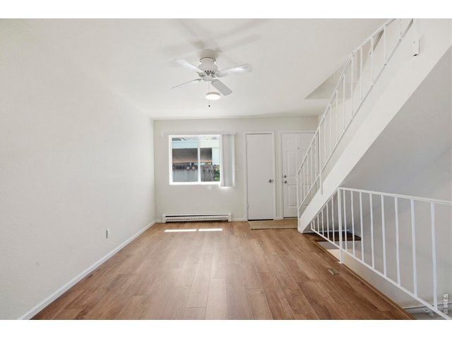 Property Photo 13 Bright and spacious living room with all with new LVP and paint.