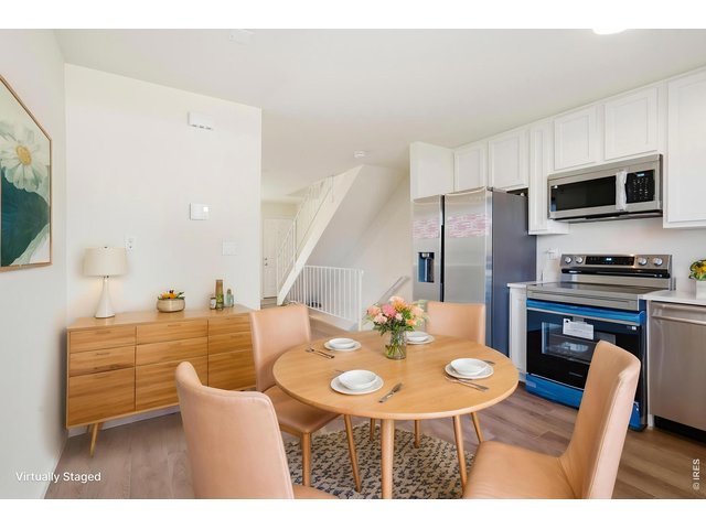 Property Photo 18 Bright eat in kitchen gives you good space for morning coffee and family dinners. ***Virtually staged with AI***