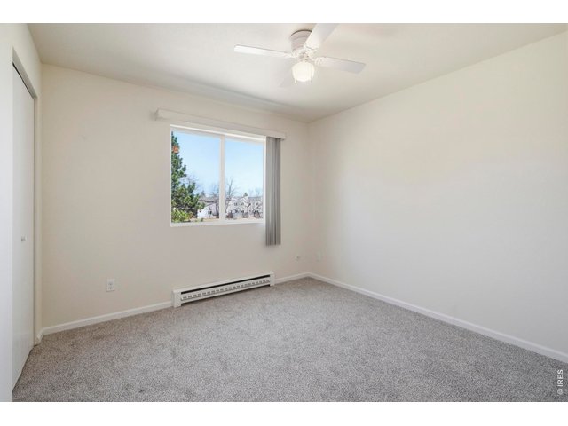 Property Photo 24 Secondary bedroom is appropriately sized as well for kids, guests, or an office.