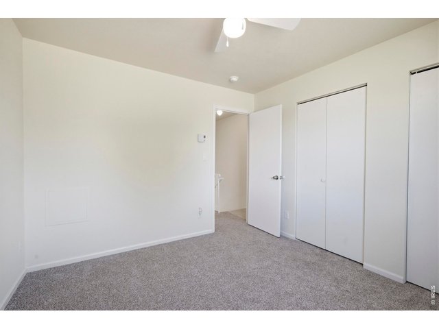 Property Photo 25 Secondary bedroom is appropriately sized as well for kids, guests, or an office.