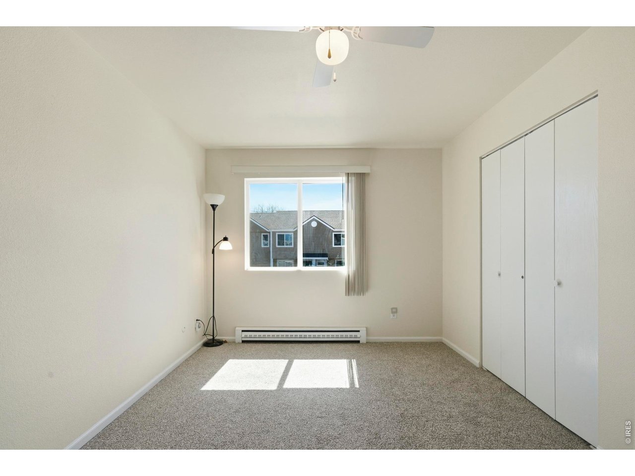 Upstairs primary bedroom is bright and spacious.