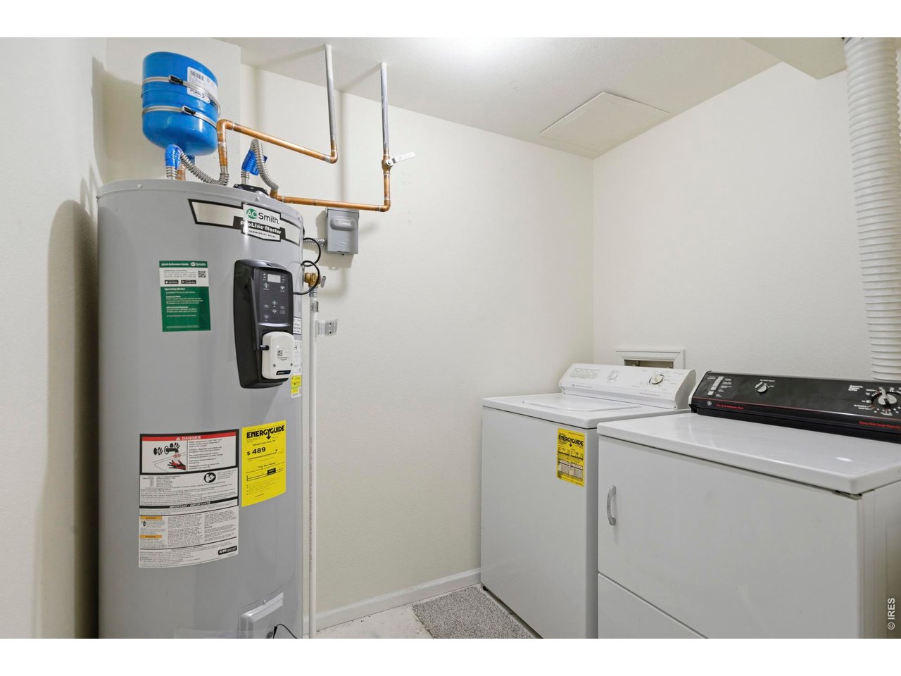 Laundry room in the basement comes with the washer and dryer, as well as a brand new smart water heater.
