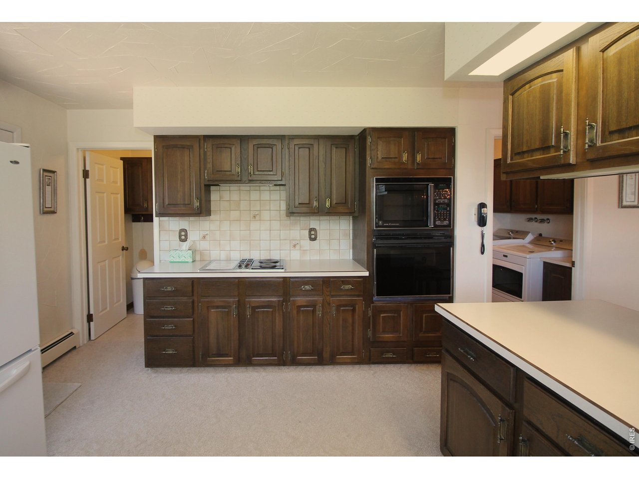 Property Photo 17 Large pantry to the left, laundry room to the right.