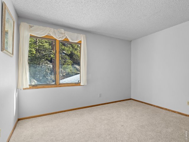Property Photo 18 Second bedroom with rock views