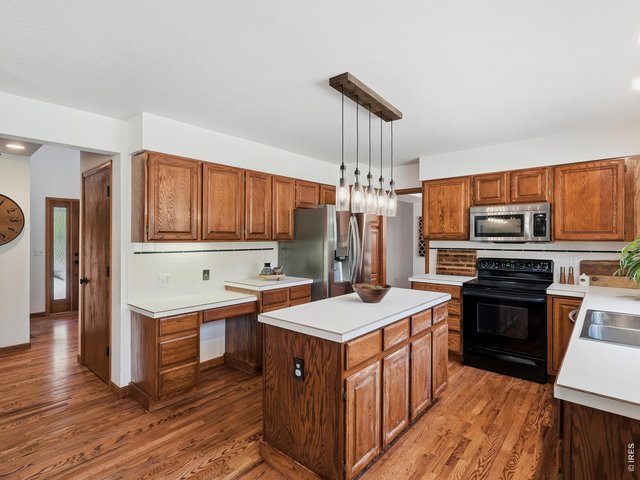 Property Photo 25 Functional kitchen with ample storage and workspace.