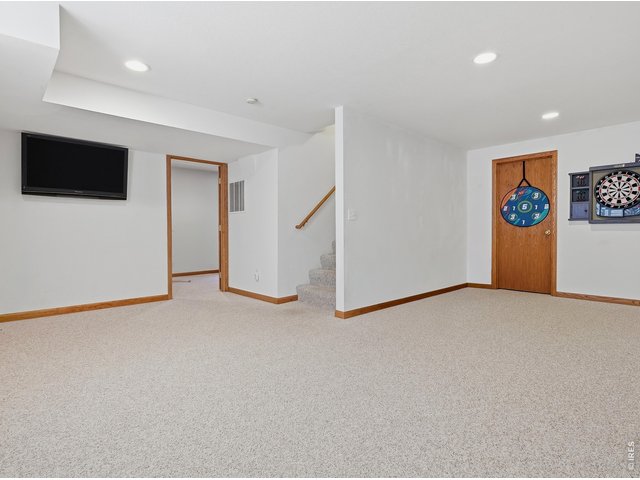 Property Photo 15 Finished Basement - Additional living space for movie nights, games, or entertaining.