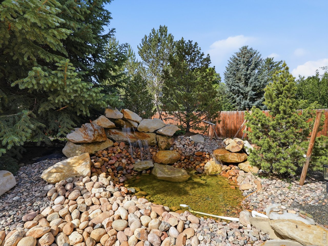 Tranquil backyard waterfall feature.
