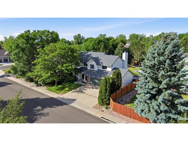 Property Photo 31 Mature landscaping adds timeless charm and year-round beauty.