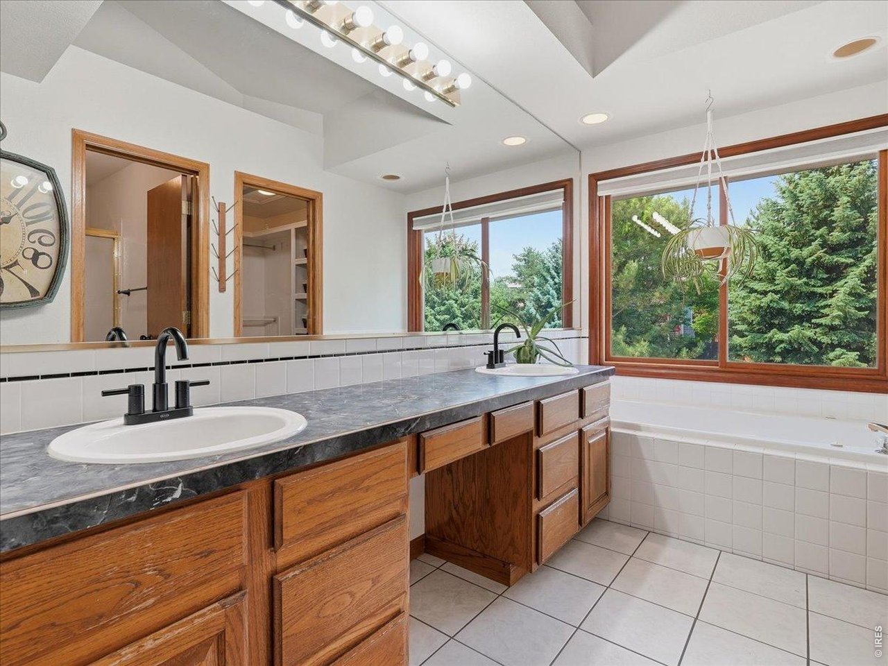 Primary Bathroom includes dual sinks and a full bath tub