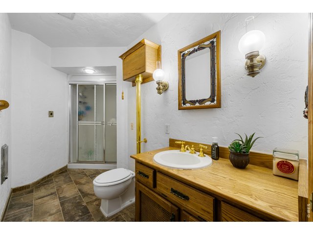 Property Photo 13 Bathroom with High tank pull code toilet