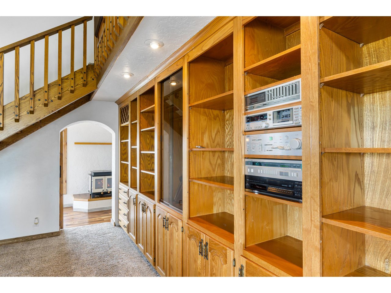 Built in shelving with rifle display case.