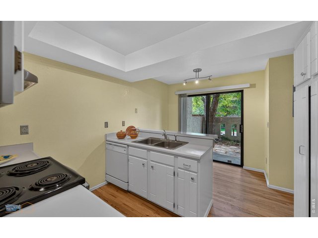 Property Photo 17 Kitchen and eat in area entrace to south/entry patio