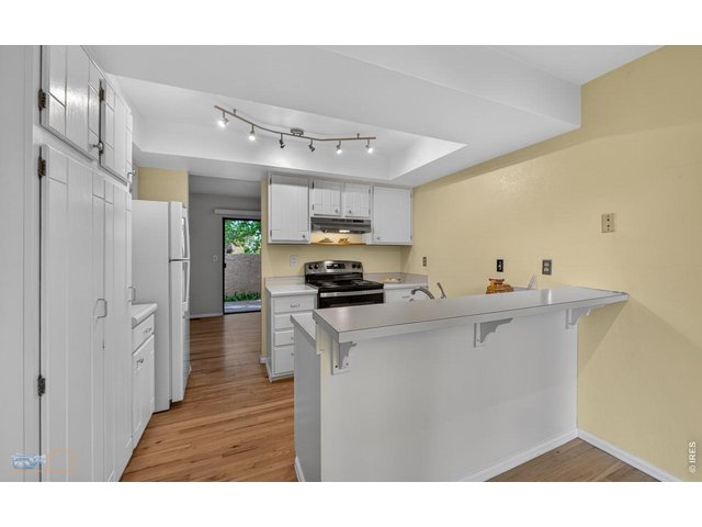 Property Photo 19 Kitchen towards dining area