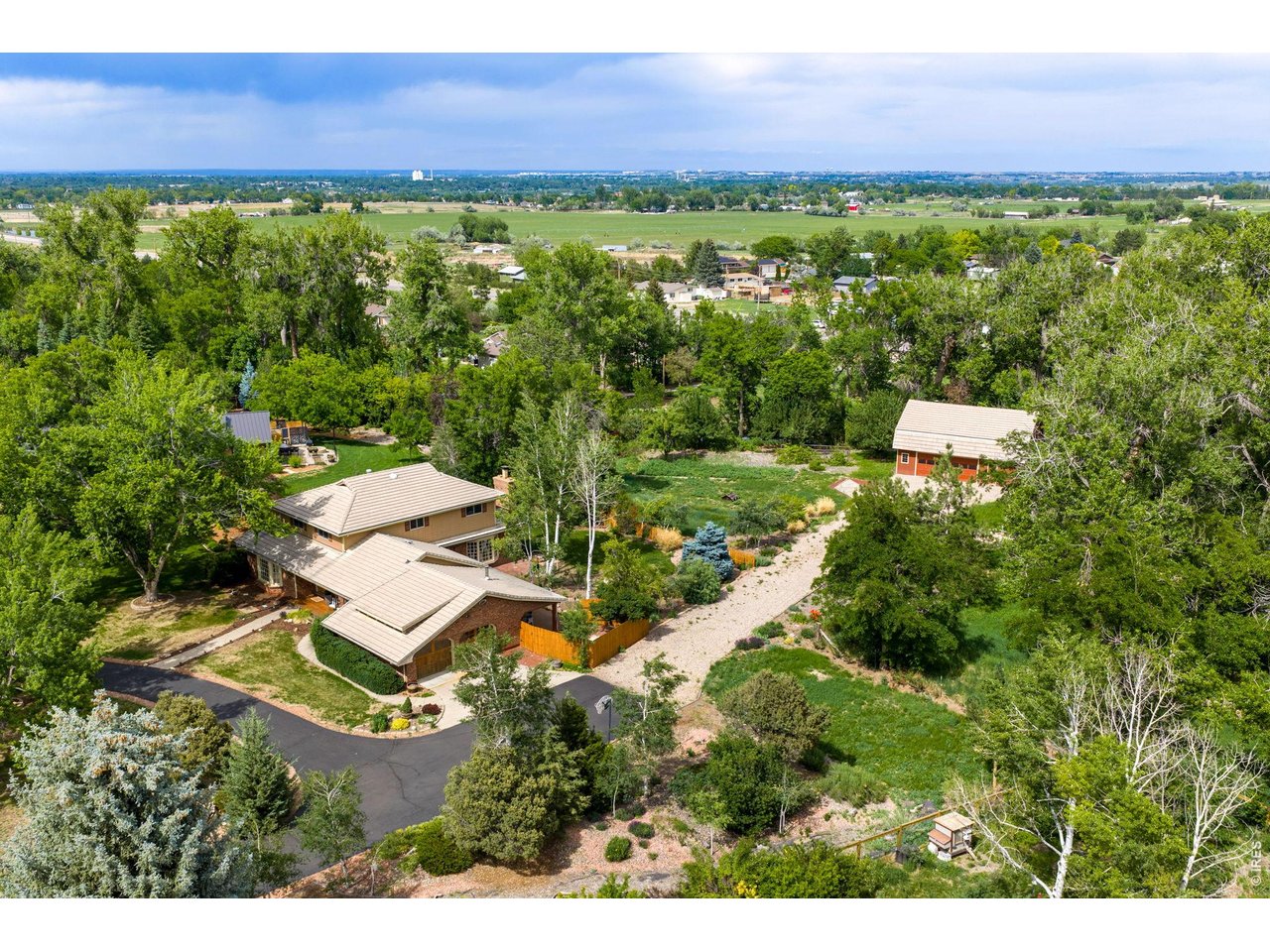 An established rural community feel with large custom properties, yet just down the road from shopping off Taft & Hwy 14, restaurants and amenities! Be greeted by the half circle driveway and towering silver Maples.