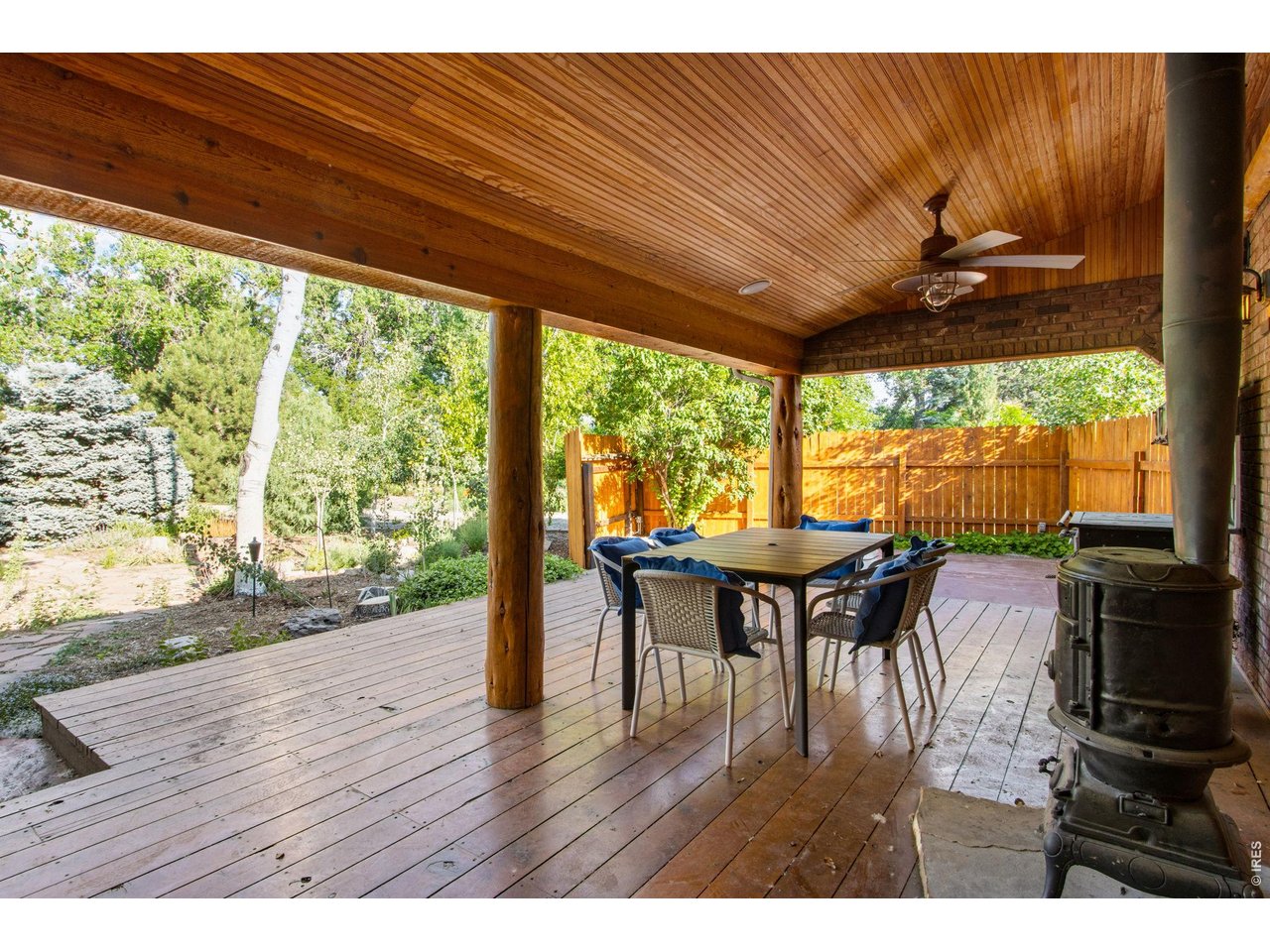 Oversized covered back deck area. Made for entertaining with 362 SF and cozy stove picture perfect backyard! 