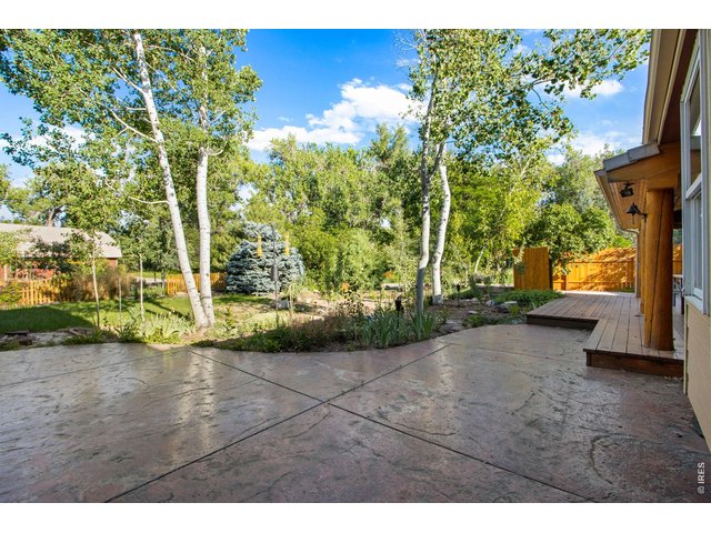 Property Photo 28 447 SF stained and stamped concrete patio for a variety of entertaining options! 