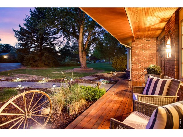 Property Photo 3 Stunning custom 2 story, spacious covered front porch dressed with gorgeous hardwoods and all brick with lush landsscaping!