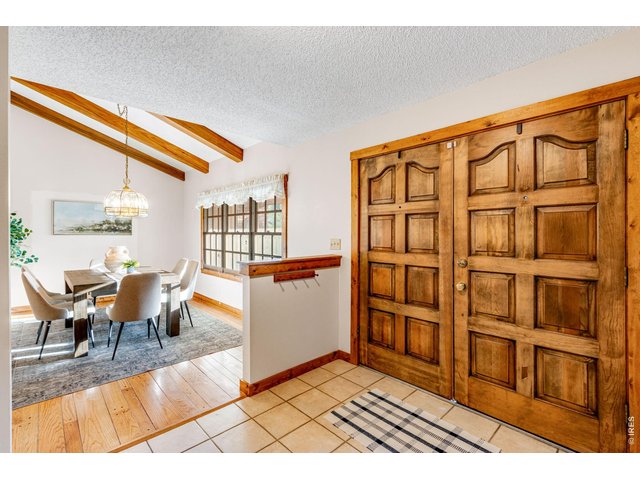 Property Photo 13 Double solid wood door welcomes you to the low maintenance tile entry 