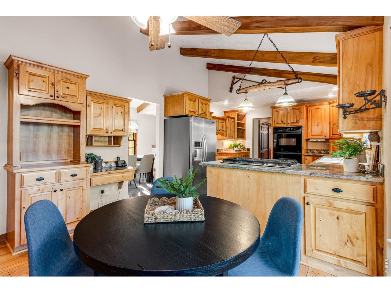 Exceptional storage all throughout local Tharp Hickory cabinetry.