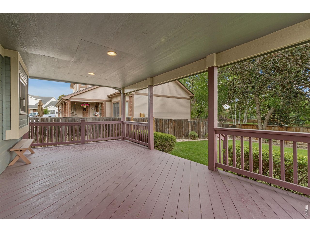 Property Photo 38 a covered deck creates the perfect setting for morning coffee, summer dining, or relaxing evenings under the Colorado sky.