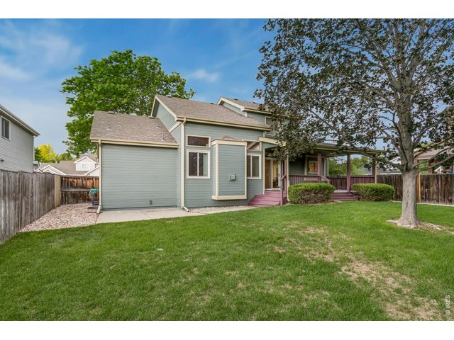 Property Photo 6 Enjoy the private, mature landscaped backyard with covered deck for relaxation and entertainment
