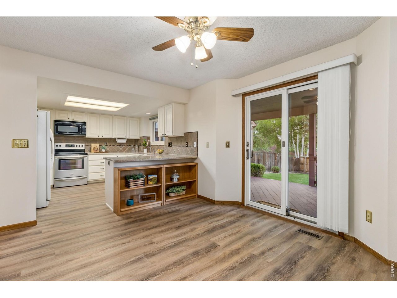 Property Photo 17 The thoughtfully designed open floor plan flows effortlessly into the casual dining area. 
