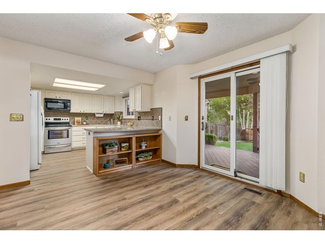 Property Photo 17 The thoughtfully designed open floor plan flows effortlessly into the casual dining area. 