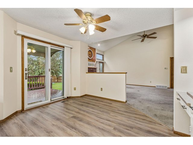 Property Photo 15 newer Luxury Vinyl plank flooring makes it clean and fresh! The covered deck is right off the kitchen to take dinner outside! 