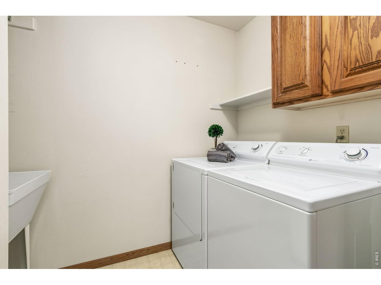 Property Photo 36 Main floor laundry room with storage and sink