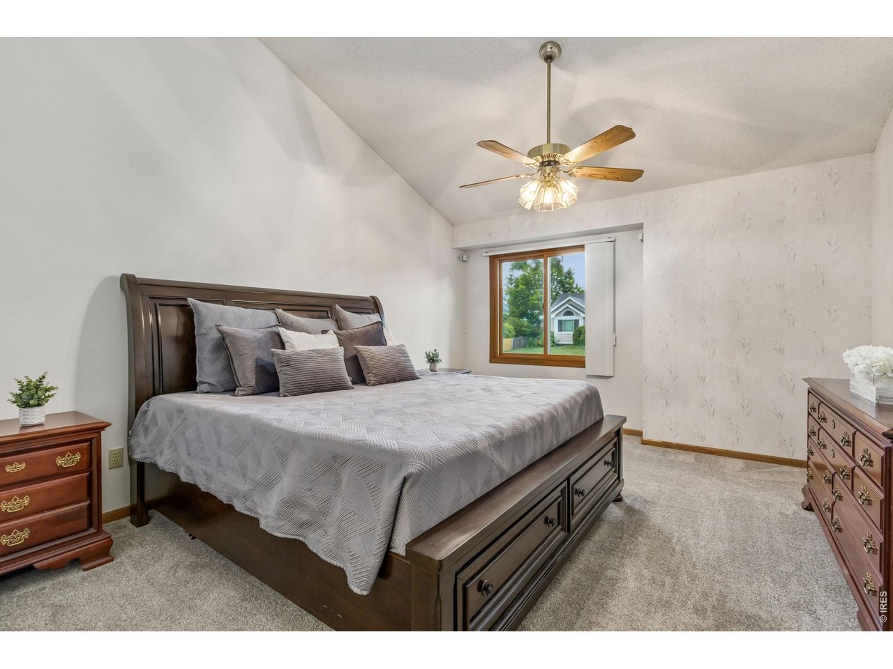 Property Photo 25 Primary suite complete with vaulted ceilings, a spacious walk-in closet, and a luxurious five-piece bath featuring dual sinks, a jetted soaking tub, walk-in shower, and linen storage.