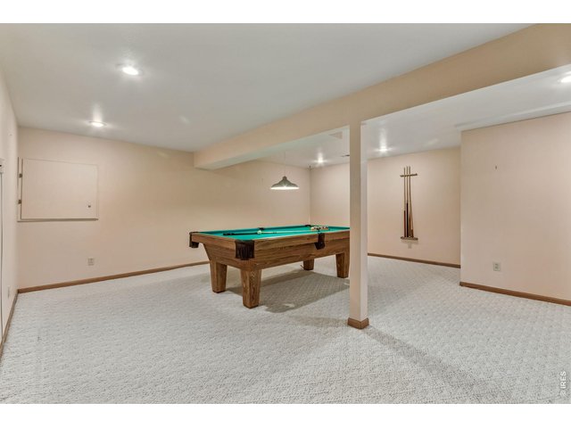 Property Photo 32 The finished basement expands the home's versatility with additional space for recreation, fitness, hobbies, or media enjoyment.