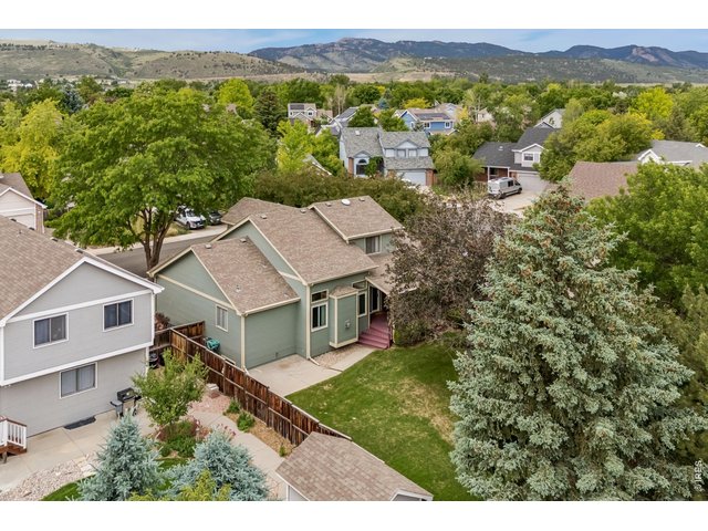 Property Photo 39 Enjoy the private, mature landscaped backyard with covered deck for relaxation and entertainment
