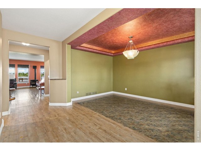 Property Photo 28 Formal dining with custom ceiling and chandelier. 