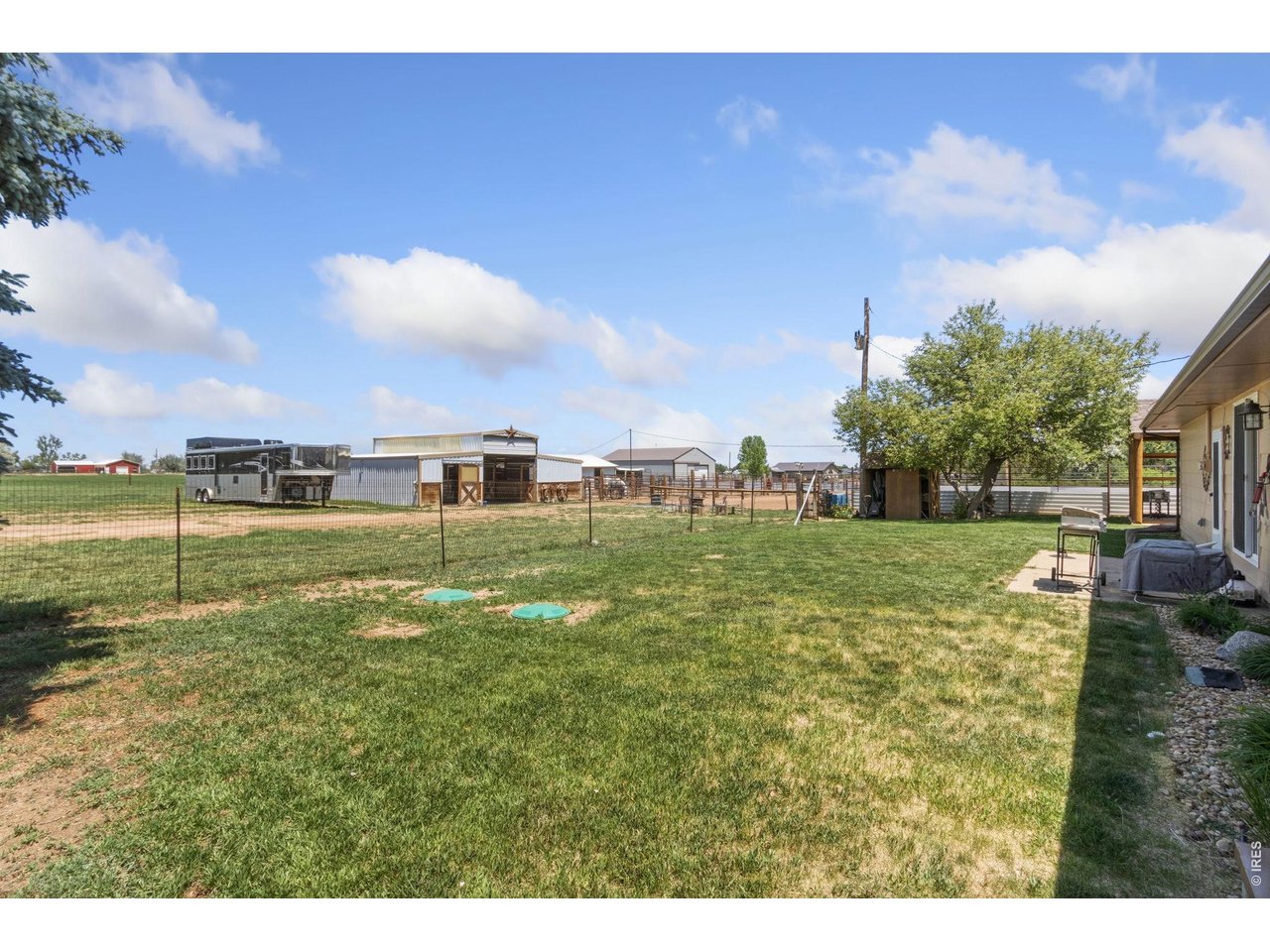 Property Photo 17 Fenced Backyard looking Toward Horse Barn