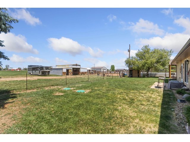 Property Photo 17 Fenced Backyard looking Toward Horse Barn