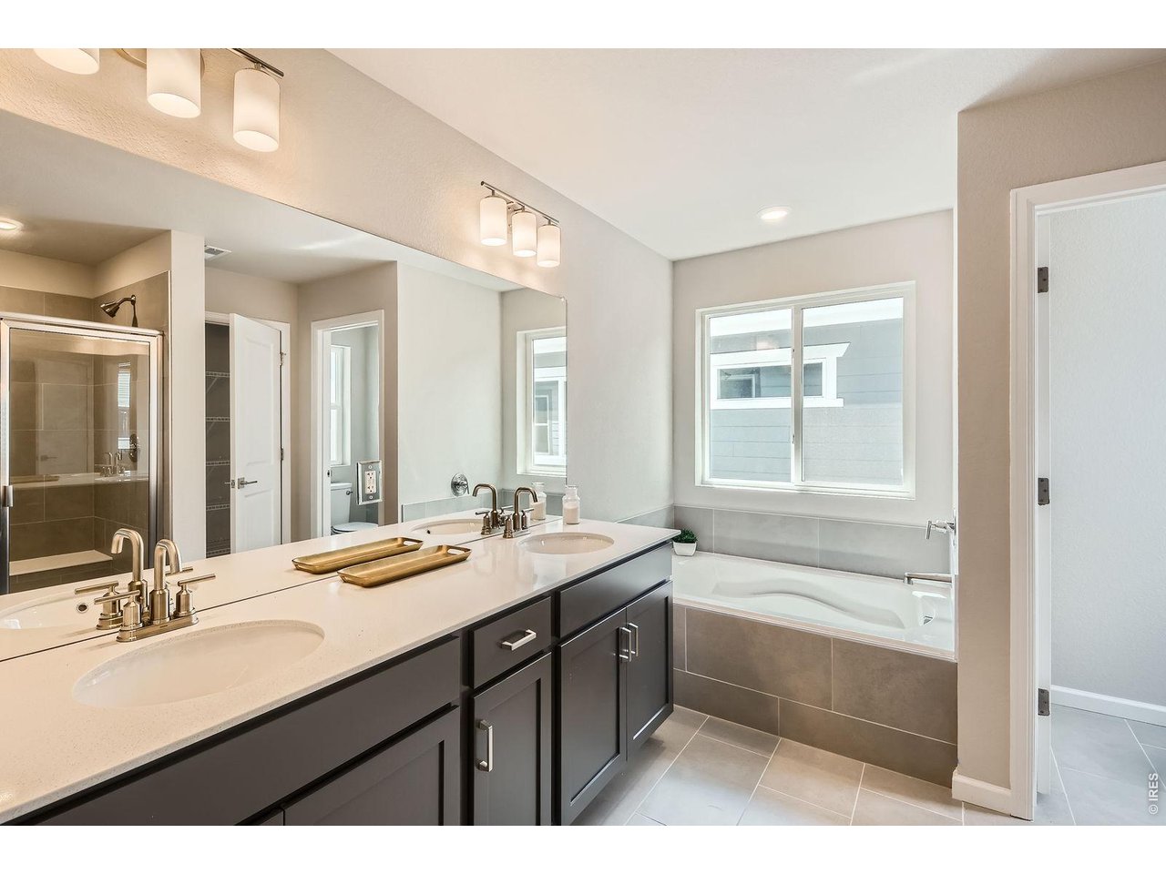 Dual vanities primary bathroom - Model Home